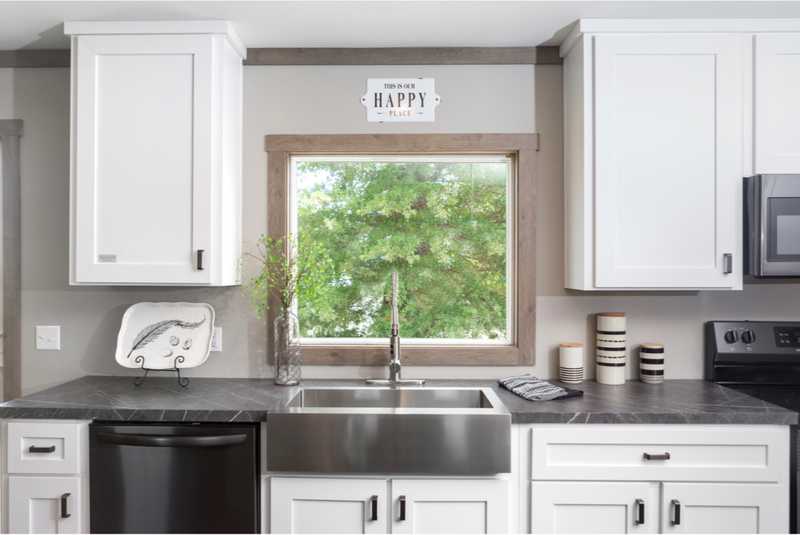 white Duracraft cabinets in kitchen with sink